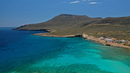 Aerial drone photo of main port of Kythera island and turquoise exotic beach of Diakofti, Ionian, Greece