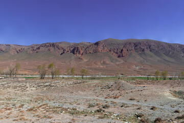Africa Morocco desert Atlas mountains nature rock landscape with river palm under blue sky hot weather 