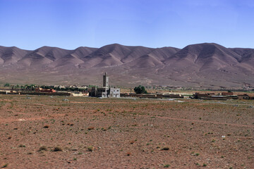 Africa Morocco desert Atlas mountains nature rock landscape with river palm under blue sky hot weather 