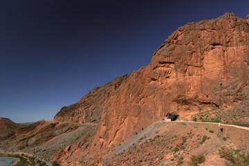 Africa Morocco desert Atlas mountains nature rock landscape with river palm under blue sky hot weather 
