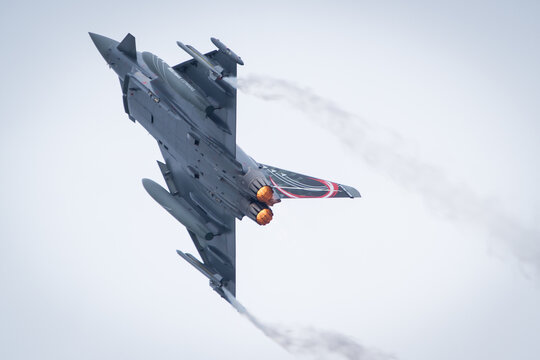 Austrian Air Force Eurofighter military aircraft on high speed with bright afterburner