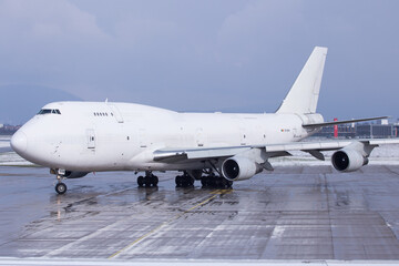 White Boeing 747-400 Jumbo Jet freighter on the ground in Graz, Austria