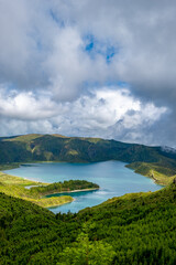 Naklejka na ściany i meble Lagoa do Fogo, a volcanic lake in São Miguel, Azores under the dramatic clouds