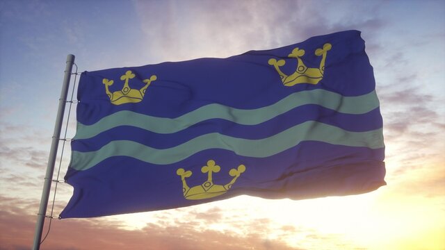 Cambridgeshire flag, England, waving in the wind, sky and sun background. 3d rendering