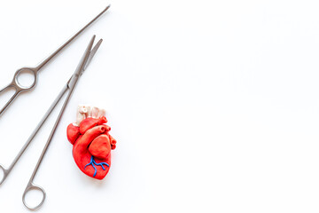 Surgical instruments and heart model. Heart surgery concept