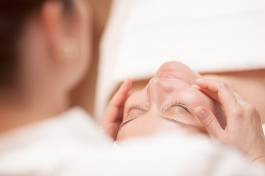 Woman getting professional facial massage