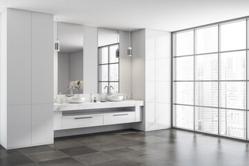 Naklejka na ściany i meble Corner view on bright bathroom interior with double sinks