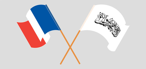 Crossed and waving flags of France and Taliban