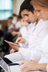 Medical students with modern devices on the lecture