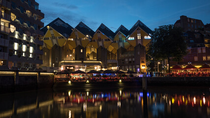 The Cube Houses and waterfront cafes in night Rotterdam