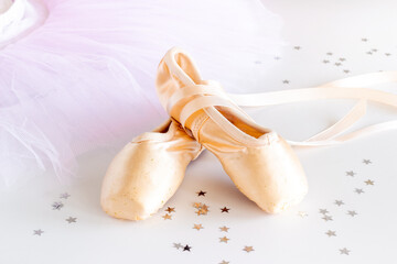 Used ballet pointe shoes on tutu skirt. Set for ballerina