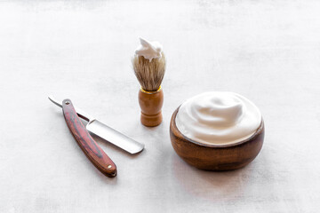 Shaving razor and foam in bowl - barber tools equipment
