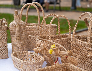 Wicker furniture items. Baskets and boxes for a picnic, linen and various things at a folk craft fair