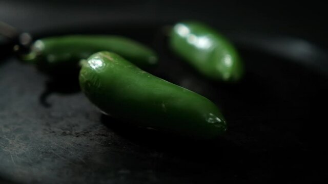 Green chili peppers on a traditional Mexican comal
