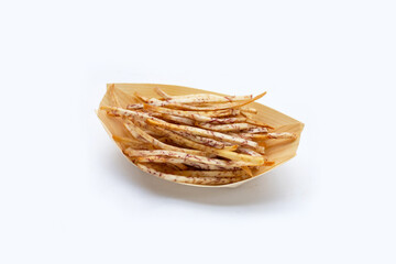 Fried taro sticks on white background.
