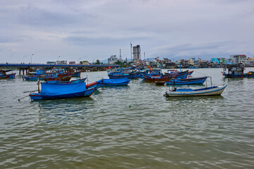 Fototapeta na wymiar Nha Trang, Vietnam- 08 December 2014: Fishing boats in the port of Nha Trang, Vietnam