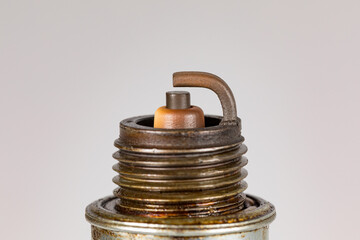 Vehicle engine spark plug isolated on white background. Automotive and small engine repair,...