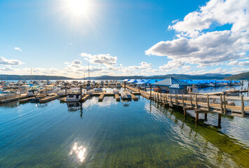 Fototapeta premium A marina on Lake Coeur d'Alene full of boats and yachts near Silver Beach in Coeur d'Alene, Idaho, USA.