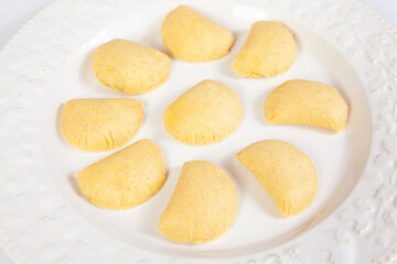 Preparation of the traditional patties from the region of Cauca in Colombia, called empanadas de pipián - Ready to be fried patties