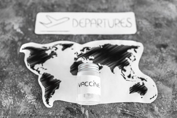 international travel after the covid-19 pandemic, world map with vaccine and departures sign