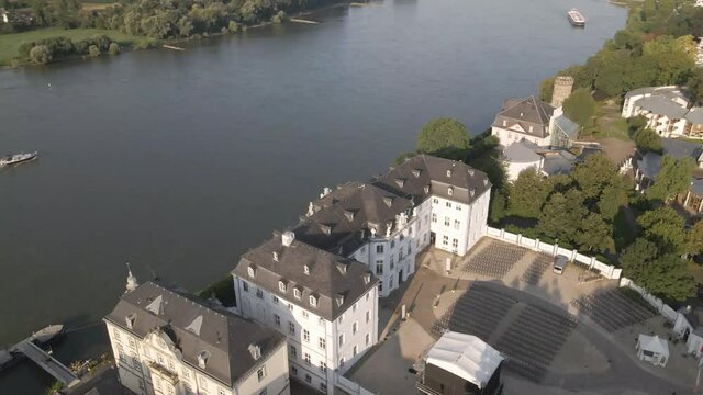 Drone Panning Directly Above Engers Town And Castle On Rhine River, Koblenz On A Sunny Afternoon