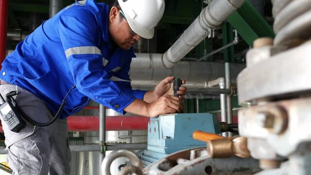 Electrical technician open motor cover for preventive maintenance PM monthly check