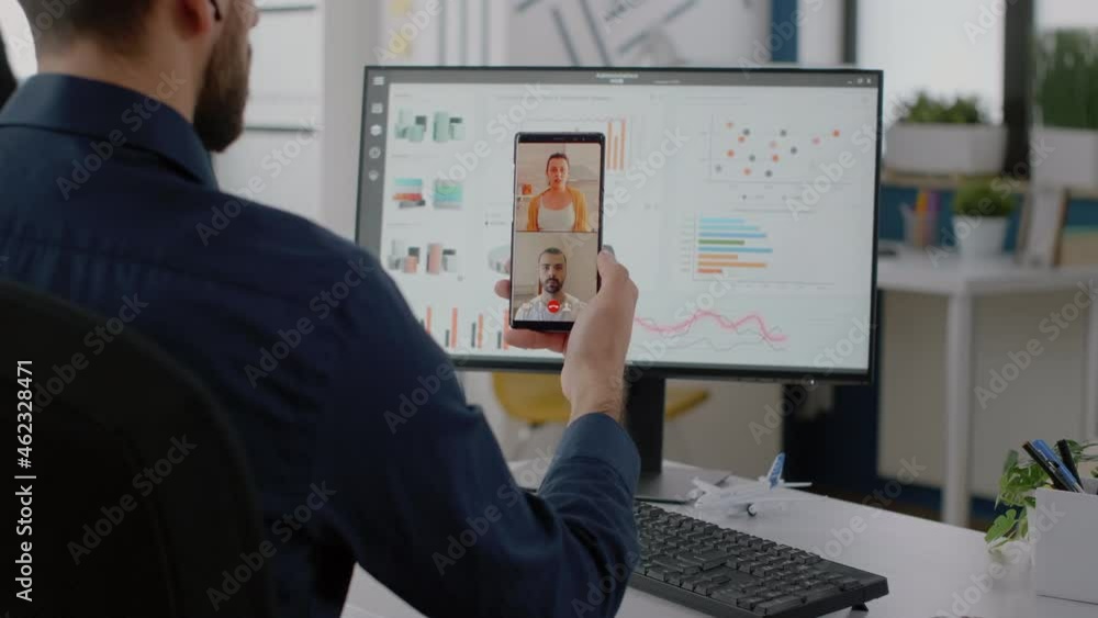 Poster corporate worker holding smartphone for video call conversation with colleagues about project planni