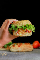 beef burger and hotdog with tomato sauce and lettuce.