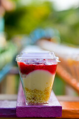 transparent cup with strawberry dessert
