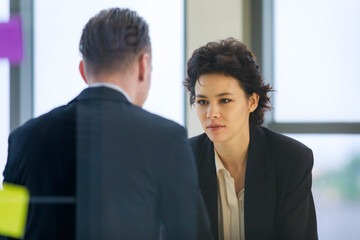 Caucasian business professional woman seriously listen to senior boss explaining job assignment of...