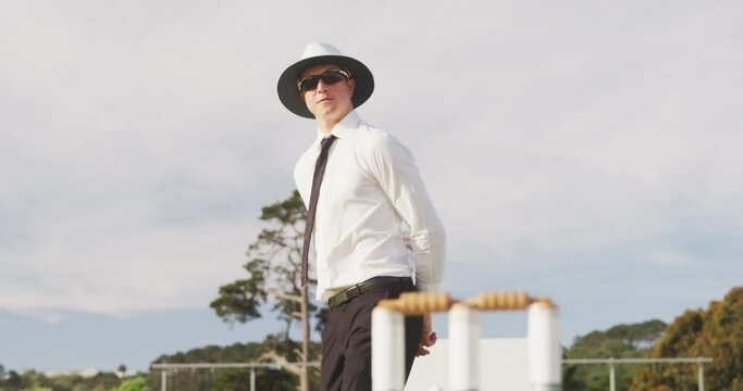 Cricket umpire making signs standing on a cricket pitch