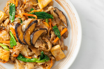 stir-fried noodles with tofu and vegetables