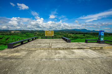 The background of modern design chairs is reflected on the cement floor, placed for viewing the...