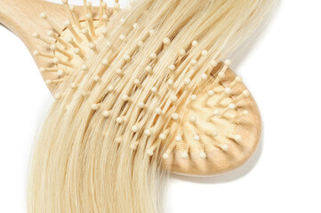 close up of micro loop ring beads straight blonde human hair extensions with a wooden comb