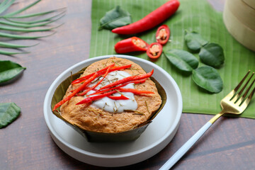 Steamed fish curry in banana leaf cups - Famous Thai food called Hor Mok or fish Amok at close up view