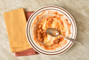 Empty bowl of macaroni and beef overhead view