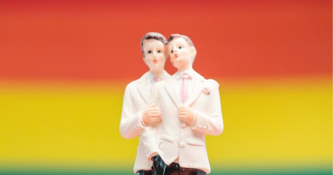 Animation of rainbow heart, love is love and gay couple figure