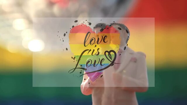 Animation of rainbow heart, love is love over rotating gay couple figure