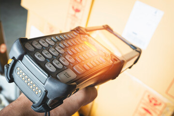 Close up, Worker Scanning Bar Code Scanner on Packaging Boxes. Computer Work Tools for Warehouse...