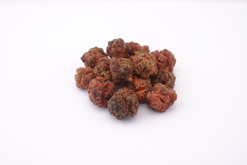 Dried cudrania tricuspidata fruit on a white background