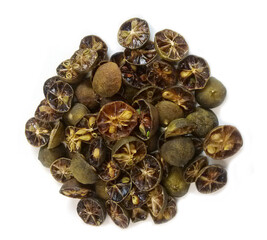 Dried calamansi berries on white background