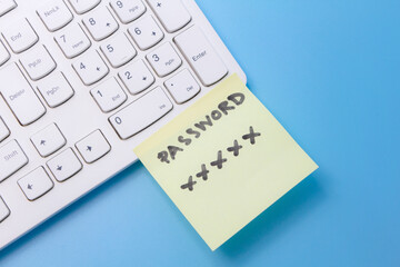 note paper of password key sticked on keyboard computer, security password management