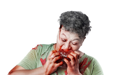 Scary zombie with blood and wound on his body eat the raw meat