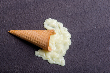 Vanilla ice cream cone melted