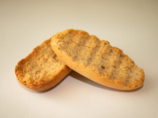 Cardamom rusks on white background