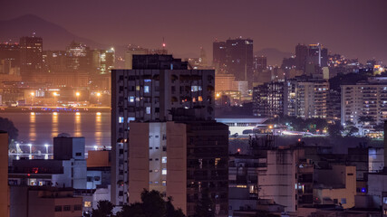 Fototapeta premium Niterói, Rio de Janeiro, Brazil - CIRCA 2021: Long exposure urban night photography with buildings and lights of a Brazilian city