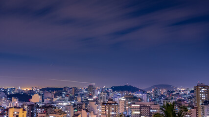 Fototapeta premium Niterói, Rio de Janeiro, Brazil - CIRCA 2021: Long exposure urban night photography with buildings and lights of a Brazilian city