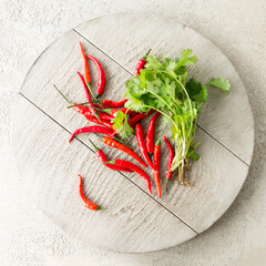 chili and fresh coriander on a light table