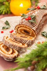 Traditional Christmas cake, chocolate Yule log with festive decorations 