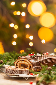 Traditional Christmas cake, chocolate Yule log with festive decorations 